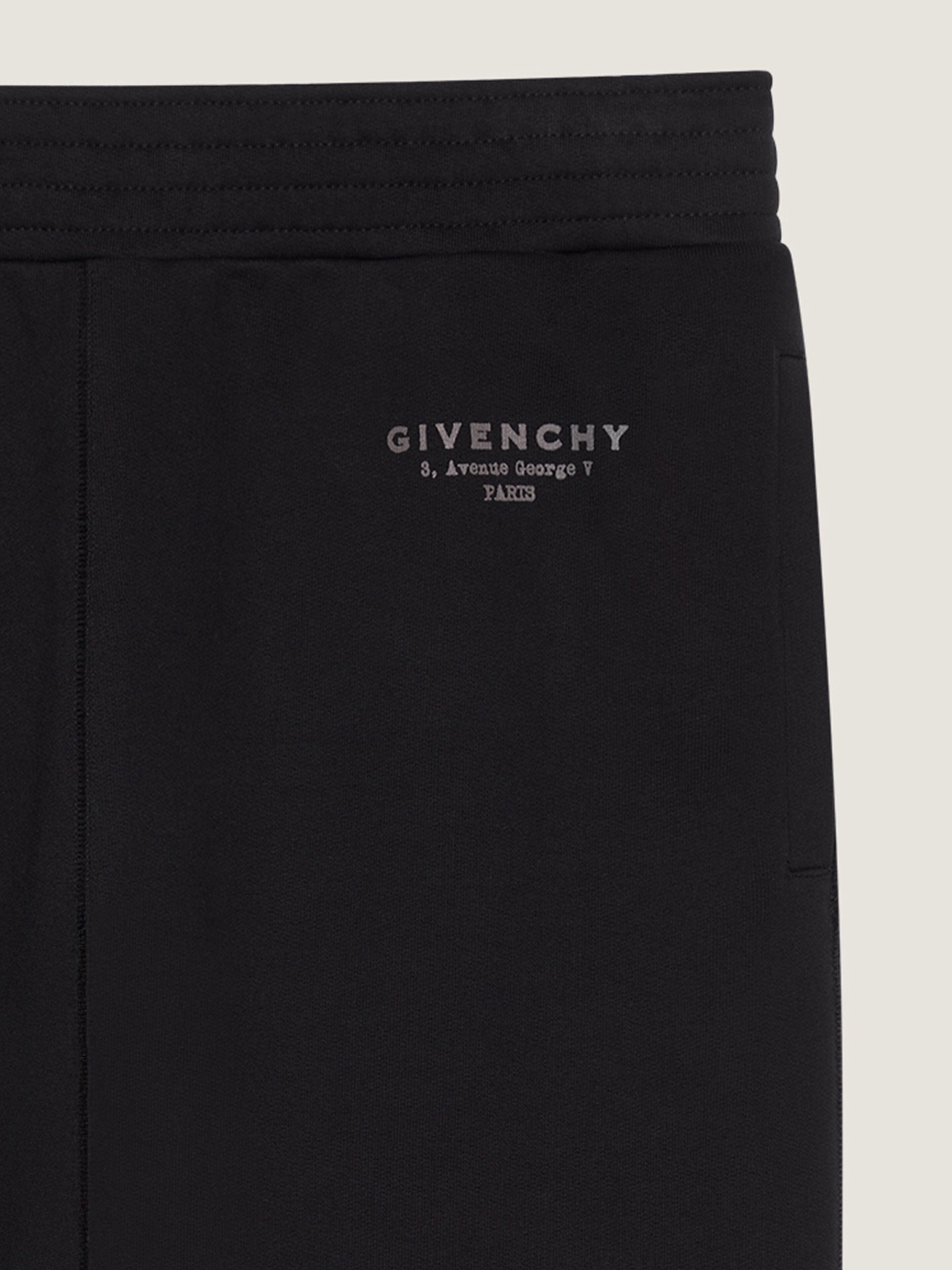 Joggers in fleece with GIVENCHY Stamp print